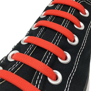 Red E3 Silicone laces in black sneaker, no tie lace